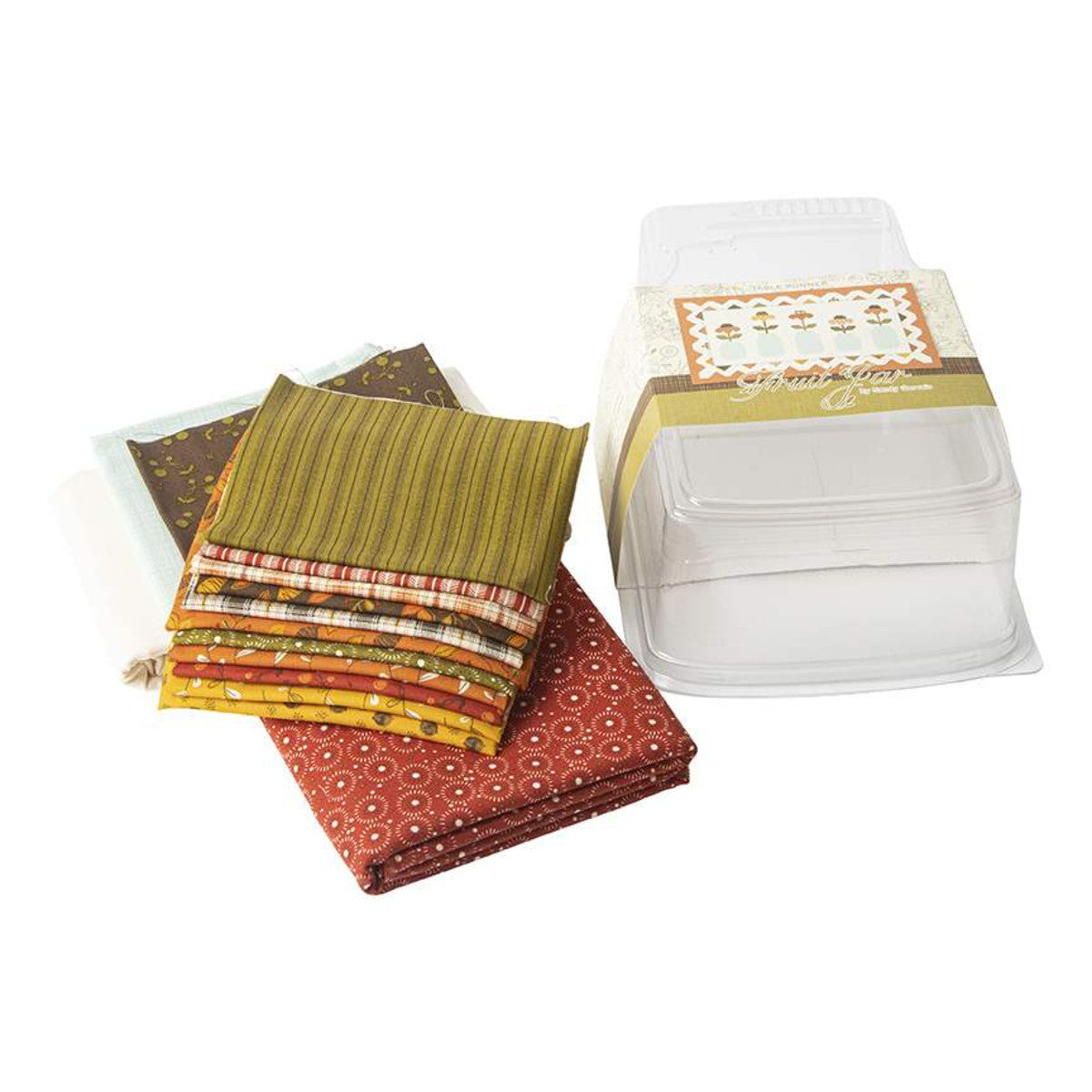 The Fruit Jar Autumn Runner Boxed Kit includes pattern and fabric for quilt top and binding. Backing not included. Fabric featured is Adel in Autumn by Sandy Gervais. Pattern is also by Sandy Gervais of Pieces from My Heart. Finished size is 32" x 56". Table runner kit comes in a reusable, plastic, jar-shaped box. Box size is approximately 6" x 10 3/4" x 2 1/2".