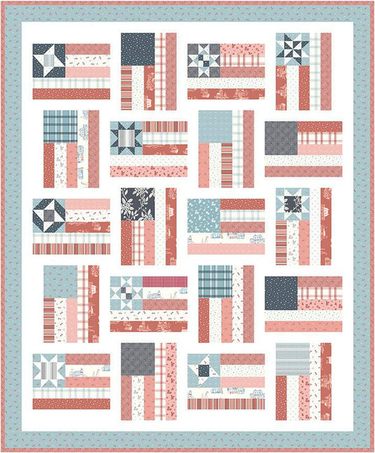 The Fly the Flag Quilt Boxed Kit includes pattern and fabric for quilt top and binding. Backing not included. Fabric featured is Portsmouth by Amy Smart of Diary of a Quilter. Pattern is also by Amy Smart. The quilt features the United States flag with various stars. Finished size is 66" x 80". Quilt kit comes in a reusable box.