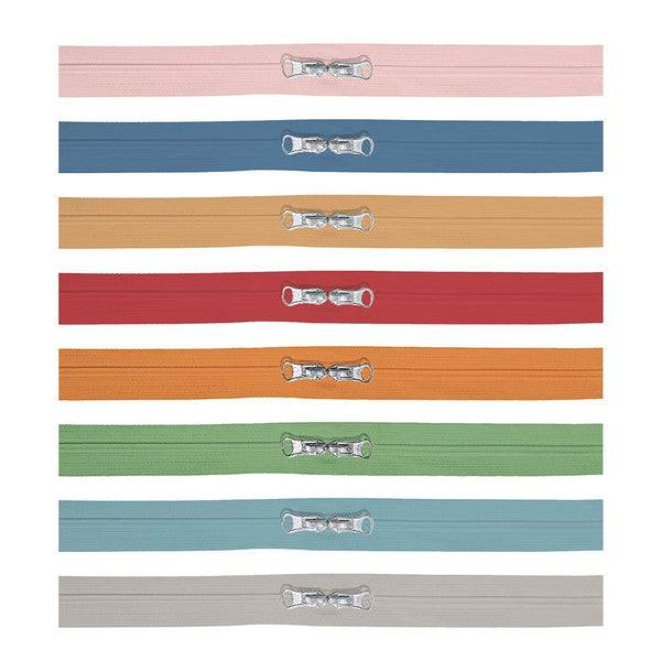 The Happy Zippers by Lori Holt of Bee in my Bonnet come in a package of 8 different zippers in Lori's fun colors. Each zipper is 1" x 16" and has 2 zipper pulls. The Happy Zippers have polyester fabric tape, zinc alloy sliders and pulls, and nylon teeth.