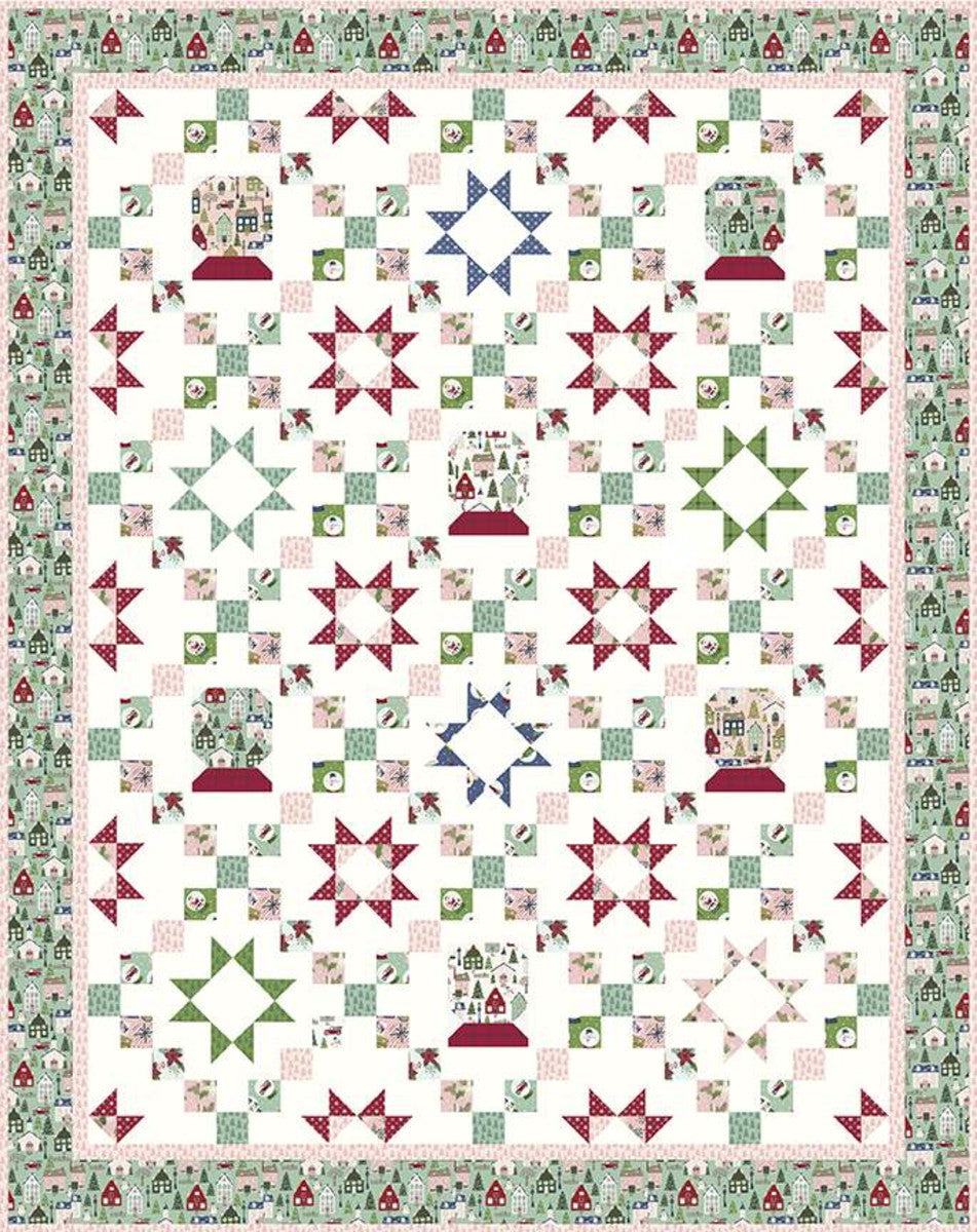 The Starry Snow Globe Quilt by Beverly McCullough of Flamingo Toes features pieced stars and snow globes set in a chain layout. Finished size is 61" x 77".  Fabric featured in quilt with the pink border is Christmas Adventure by Beverly McCullough  The quilt with the seaglass border features the Christmas Village collection by Katherine Lenius for Riley Blake Designs.